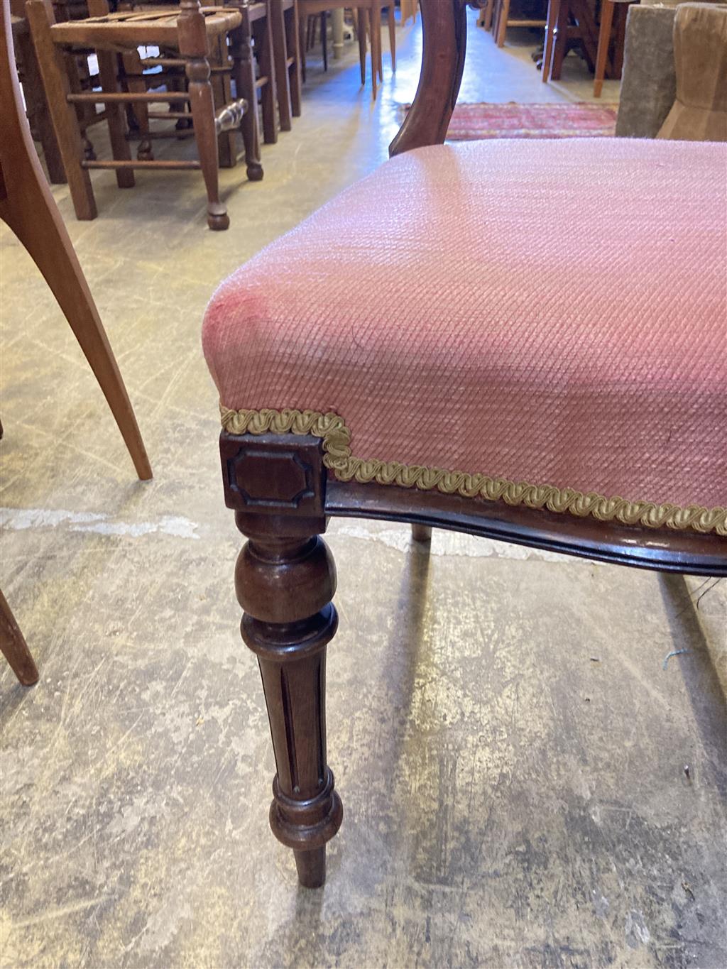 A set of six Victorian rosewood spoon back dining chairs